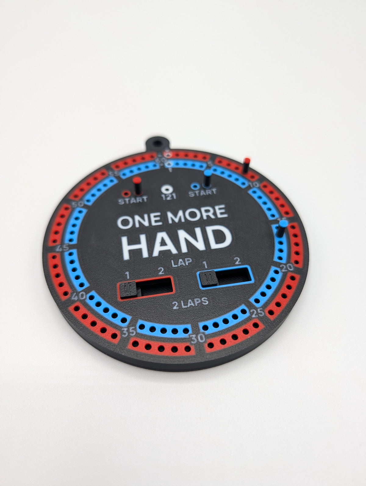 One More Hand playable cribbage Christmas ornament with red and blue tracks, white lettering and lap sliders.