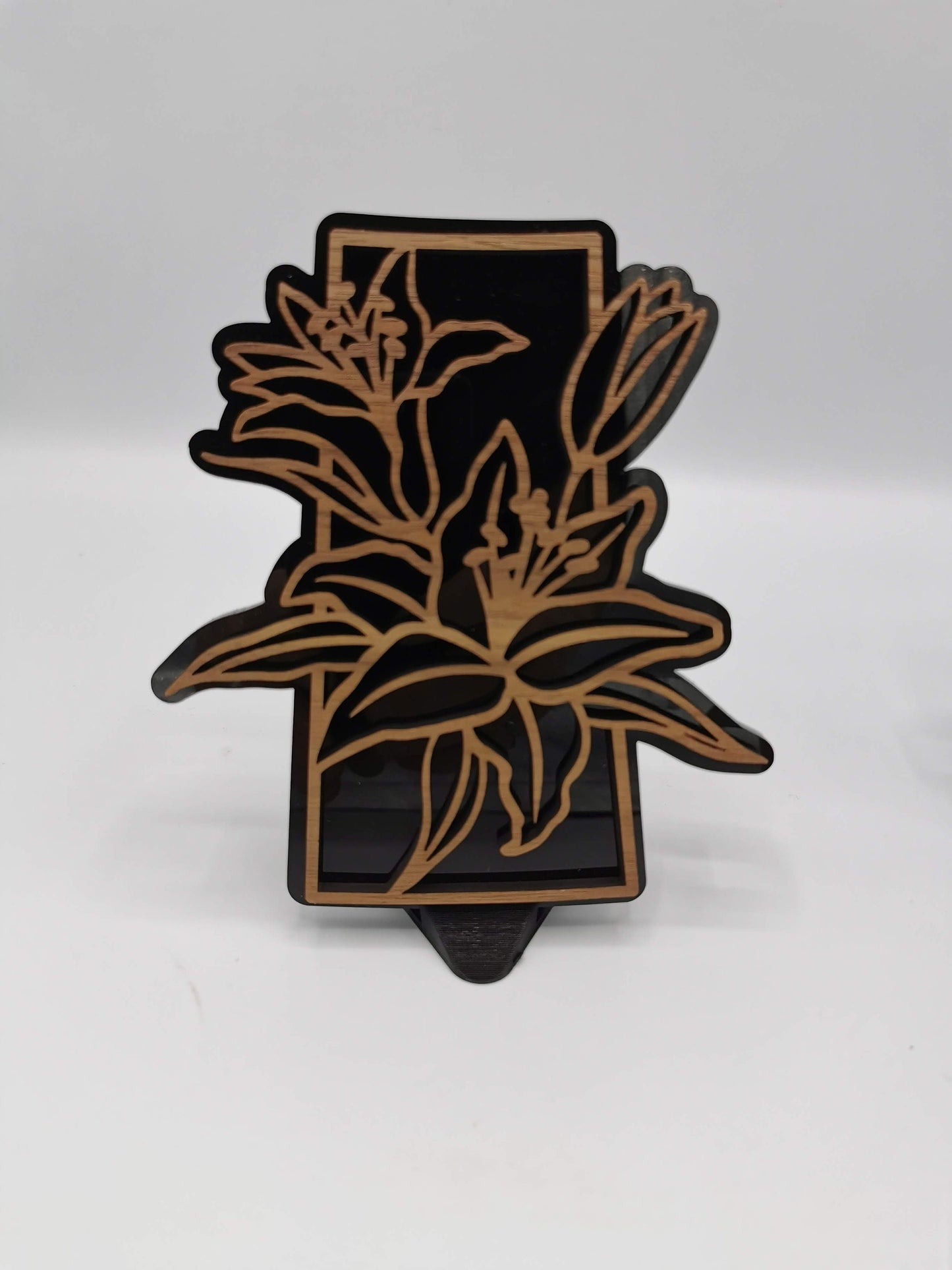 Saskatchewan art - Decorative wood cutout with lilies over the shape of the province