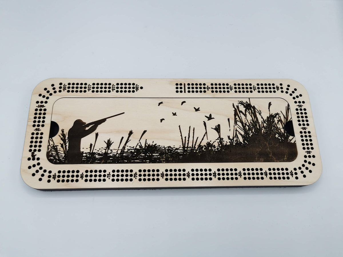 Hunting themed engraving on a three-track cribbage board