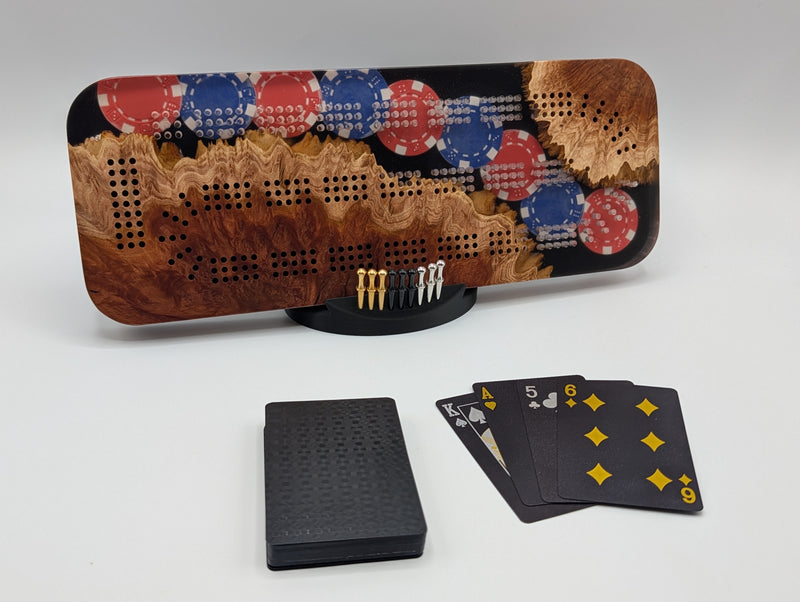 Imprint cribbage board with Australian red mallee burl and red and blue poker chips embedded in epoxy.