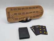 Zebrawood cribbage board with its display stand, pegs and playing cards.
