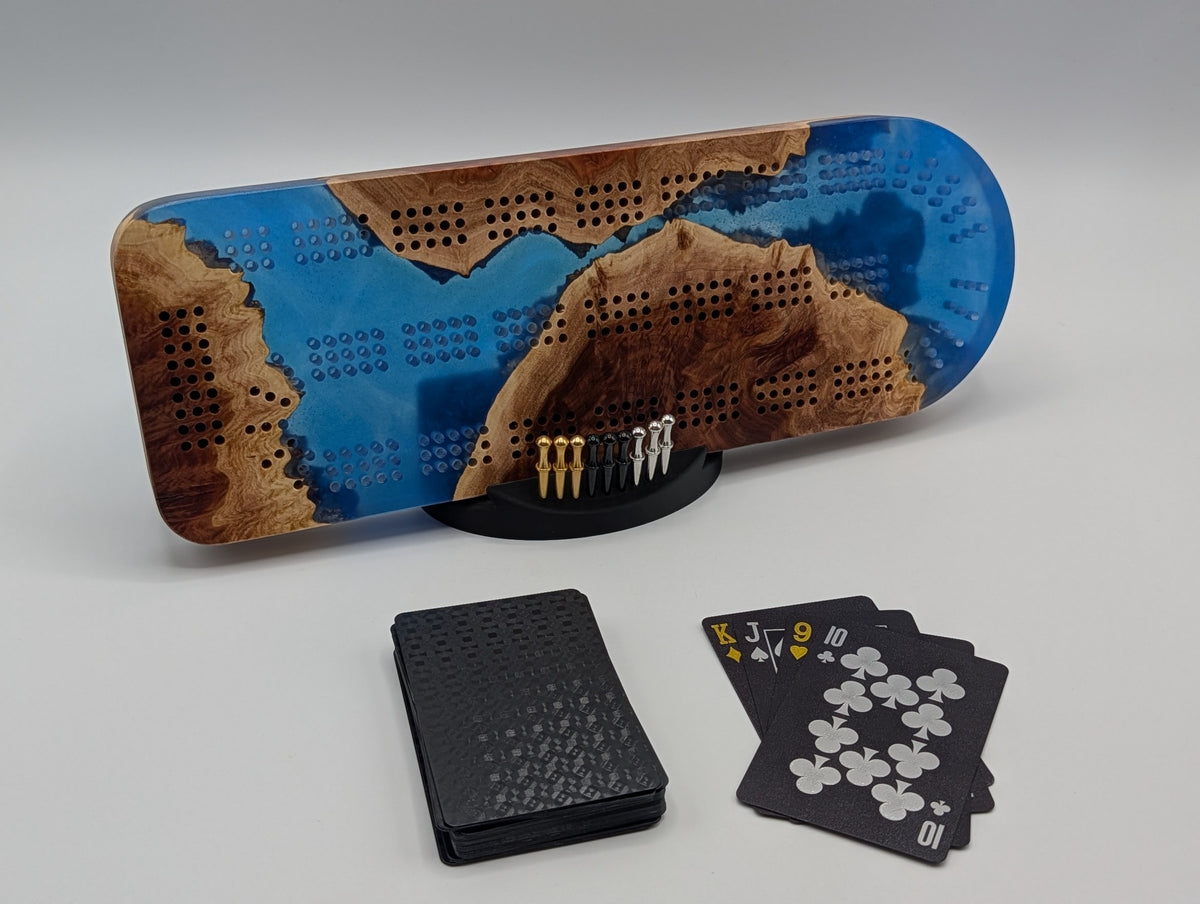 Origin No. 06 Cobalt Passage Australian red mallee burl cribbage board with cobalt blue resin, cards, pegs and stand.