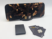 Origin cribbage board in Mexican Brasiletta wood and deep midnight blue epoxy, displayed with pegs, cards and stand.