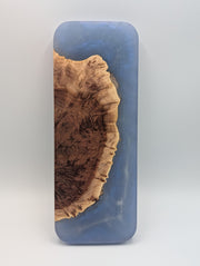 Reverse of the Australian red mallee burl and storm blue epoxy Origin cribbage board, showing the natural burl edge and blue resin.
